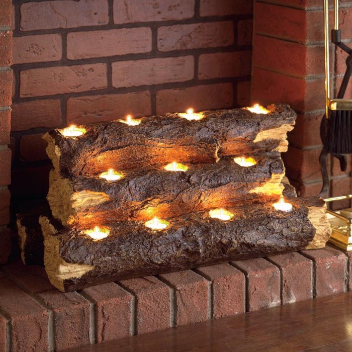 wooden logs with tealights placed inside create a more natural look of a burning fireplace