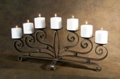 a refined metal candelabra with candles is all you need for a cozy fireplace