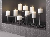 modern styling with black pebbles and a laconic metal candelabra for a minimalist space