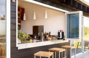 a pass through folding window is the easiest and most traditional way to open the kitchen to outdoors and make your space connected to it