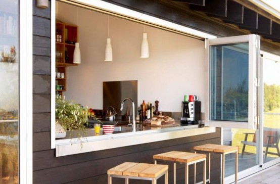 a pass through folding window is the easiest and most traditional way to open the kitchen to outdoors and make your space connected to it