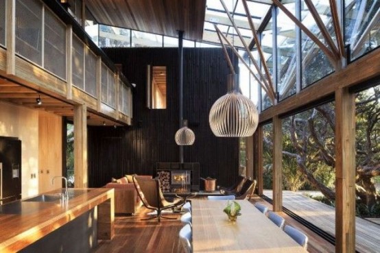 a contemporary black and stained kitchen with an eating zone and a garage wall that can be removed to open the kitchen to outdoors