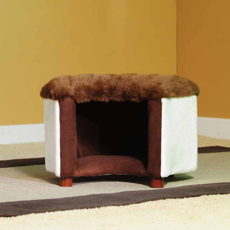 an ottoman and pet bed in one covered with faux fur is a very cozy piece for your pets