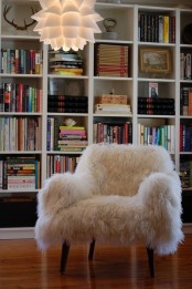a white faux fur chair is an ultimate piece for a reading nook or a library, it’s amazing to read on it
