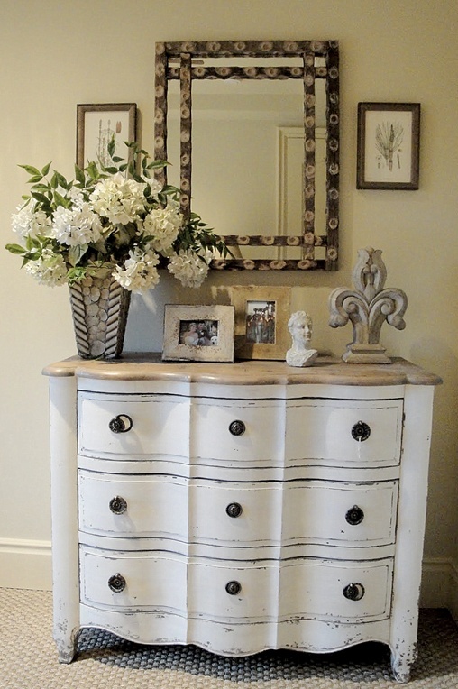 a whitewashed vintage dresser with black knobs is a lovely idea for a vintage, farmhouse or shabby chic space