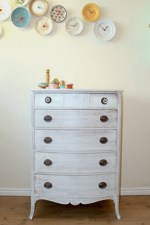 a small and tall whitewashed dresser with vintage black knobs is a lovely solution for many interiors and it gives enough storage space