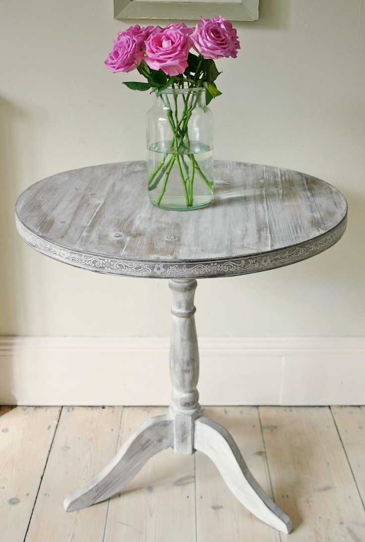 a whitewashed round table is a lovely idea for any vintage or shabby chic space and it looks amazing