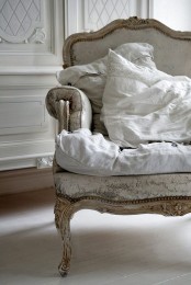 a vintage whitewashed chair with neutral upholstery is a lovely idea for a sophisticated space