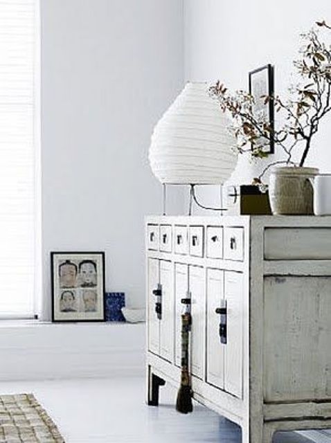 a whitewashed credenza with creative handles and a long tassel is a very pretty and chic idea for any vintage or shabby chic space