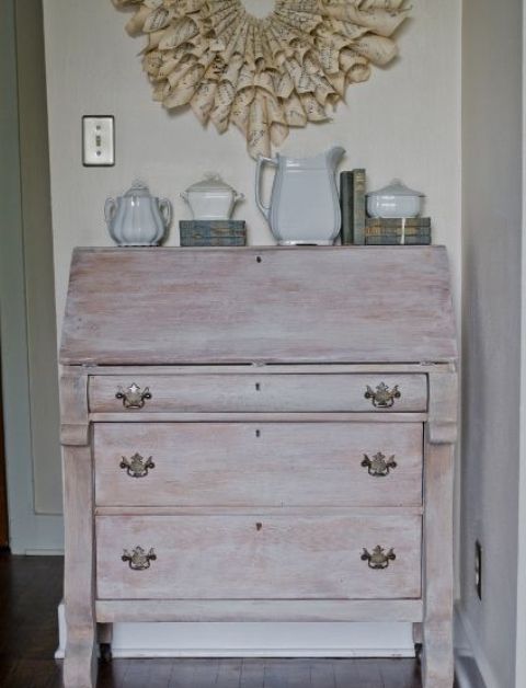 a whitewashed vintage dresser with refined handles is a beautiful idea for a vintage or shabby chic space