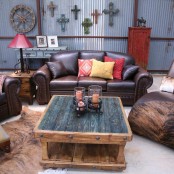 a rustic meets industrial living room with leather and wood furniture, with reclaimed wood and corrugated metal
