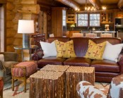 wooden walls, stick coffee tables and leather furniture make the space rustic and cool