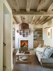 wooden beams, a fireplace and wooden rustic furniture plus built-in furniture