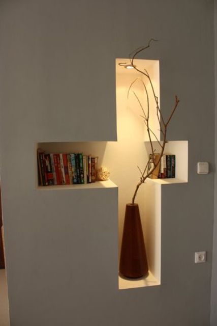 a cross shaped niche shelf with additional light will be a great storage space and will be your beautiful decor at the same time