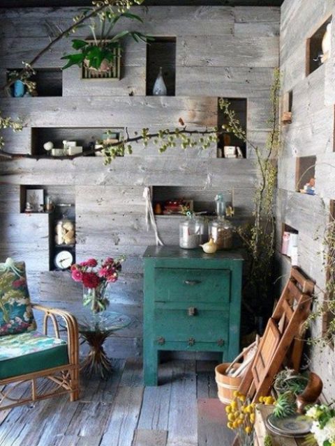 wooden slab walls with niche shelves in them are a creative idea for any space, they give a lot of storage space without taking any floor space