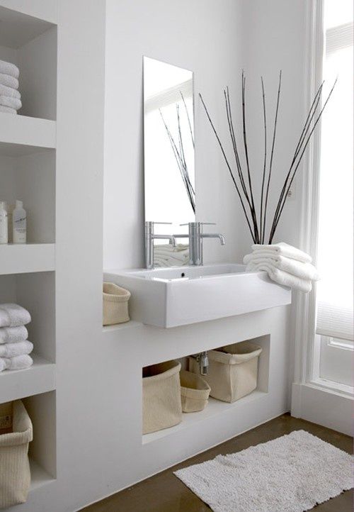a built-in niche shelf in the vanity is a lovely idea for a bathroom, it's a great way to store some stuff