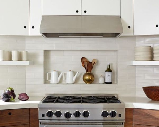 a small niche shelf integrated right into the backsplash is a lovely idea to store things right and save some space