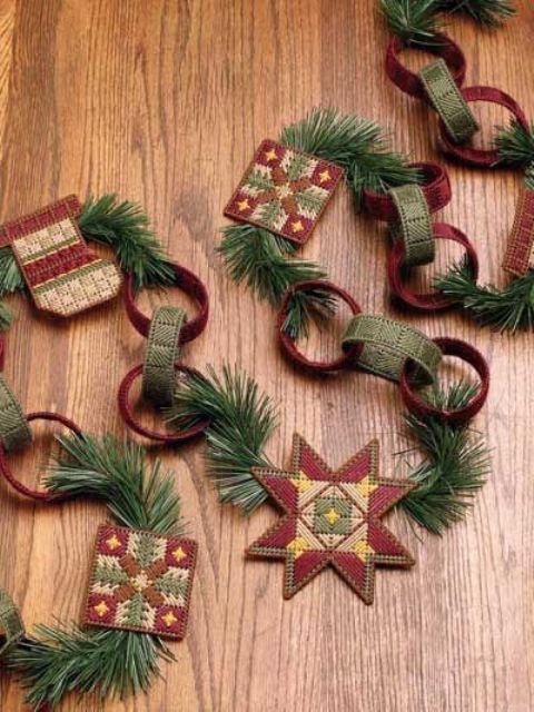 a creative Christmas garland of colorful fabric chain and evergreens and stars is a lovely and bright decor solution