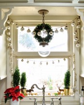 a Christmas garland composed of mercury glass Christmas ornaments is a lovely and cool decoration and you may apply it anywhere