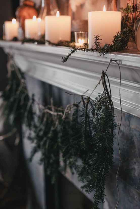 a rustic holiday garland of evergreens is an easy to make piece, it will bring a woodland touch to the space