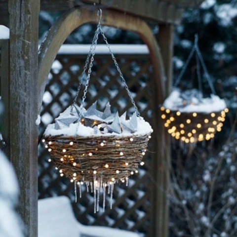 Hanging planter baskets with Christmas lights are perfect things to dress up your garden for holidays.