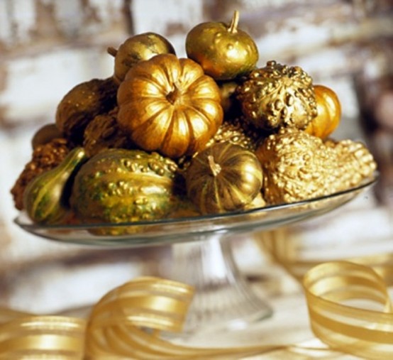 a glass stand with gilded pumpkins and gourds is a shiny and bright fall centerpiece you can easily make
