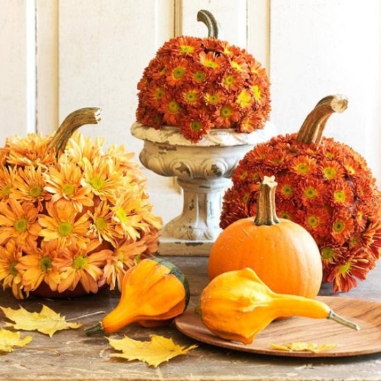 burgundy and orange flower covered fall pumpkins and gourds for a bright and fun fall centerpiece