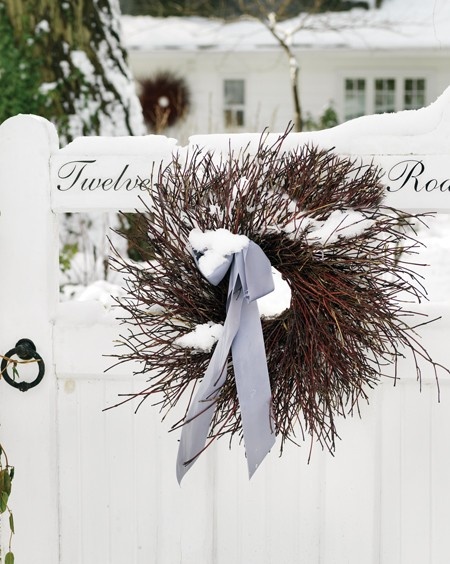 Twig wreath is an original touch to any front gate. A small ribbon bow would welcome you and your guests with the festive mood.