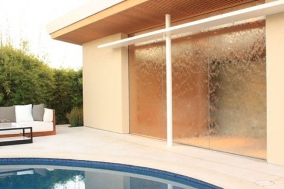 If you have a glass wall in your house you can turn it into a gorgeous water feature.