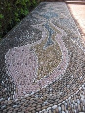 a gorgeous pebble pathway done with patterns in several colors – pink, blue and tan to add pattern and colro to your space