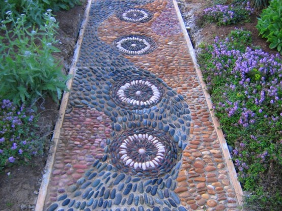 a green, burgundy, rust and grey pebble pathway with several patterns and neutral lining up is a very bold idea with a boho feel