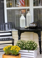 potted blooms in crates are always a good idea to spruce up your porch for spring