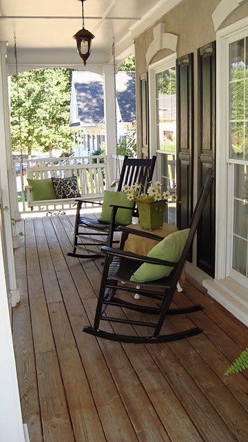 spruce up your fornt porch furniture with colorful spring throws and add some blooms and voila, your porch feels like spring