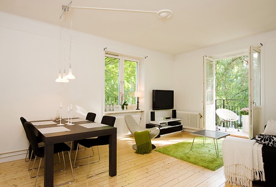 Apartment With Light Wood Floors & Painted White Walls