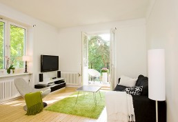 Apartment With Light Wood Floors & Painted White Walls