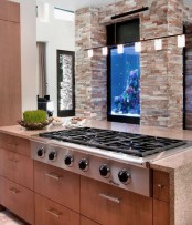 a built-in aquarium makes the space look more relaxing and natural and adds to the decor of the space