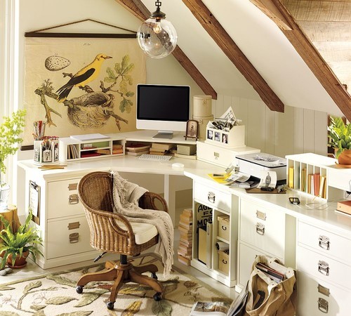 a nature-inspired attic home office with wooden beams on the ceiling, a large corner desk with lots of storage units, potted plants, a bird poster and a botanical rug is very cozy