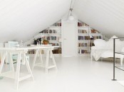 a pure white attic home office with built-in bookshelves, a trestle desk, a refined vintage sofa, a lamp under the ceiling feels very airy