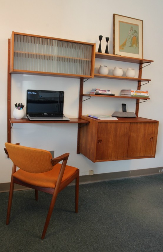 a floating wall-mounted storage unit with a cabinet and some open shelves plus a desk incorporated