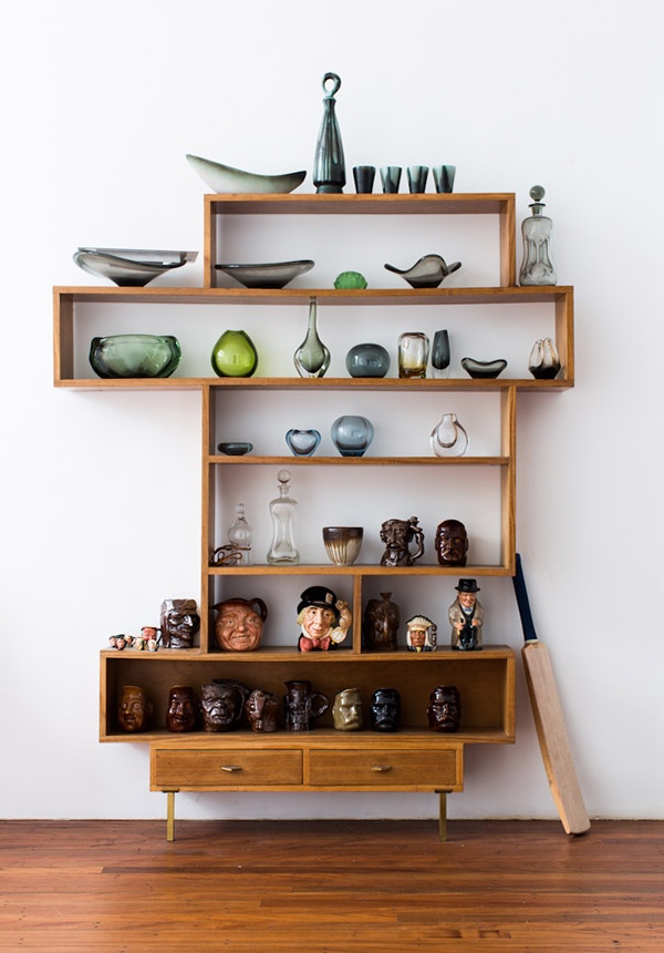 a laconic and catchy wall unit with open shelves, box shelves and drawers is a chic and bold idea