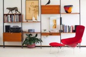 a mid-century modern wall unit with drawers and cabinets, open shelves and a bookshelf