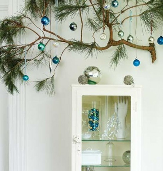 attach a branch and hang some Christmas ornaments on it to make your space more festive and bright