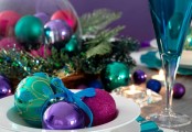 place some colorful Christmas ornaments into bowls and cloches to make your tablescape bolder and whimsier