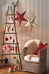 a ladder with various Christmas ornaments is a cute and very mobile Christmas decoration to go for