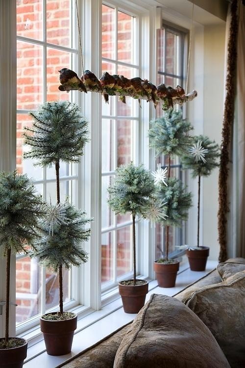 A bunch of faux tabletop evergreens in different sizes would make a perfect windowsill's display.
