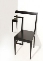 a double black corner chair that features a back that can be placed on the corner is a cool idea for a modern space, they can make use of an awkward corner
