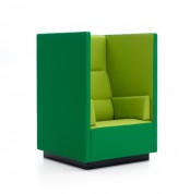 a tall chair in emerald and light green, with tall sides, allows to feel more intimate when sitting, perfect for introverts