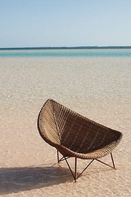 a leaf-shaped wicker chair will be a great idea for outdoors, it's a modern take on traditional wicker chairs and it looks cooler