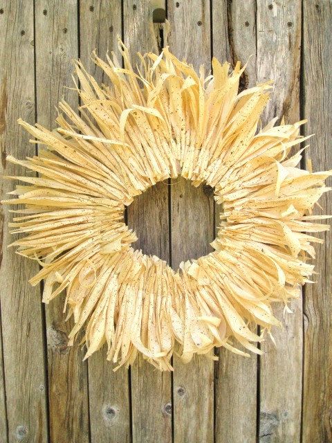 a dired corn husk wreath is a traditional fall decoration that you can eaisl DIY and hang outdoors