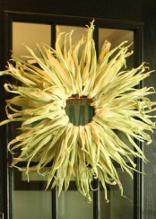 a simple and cool corn husk wreath is a lovely rustic decoration for your outdoor space for the fall